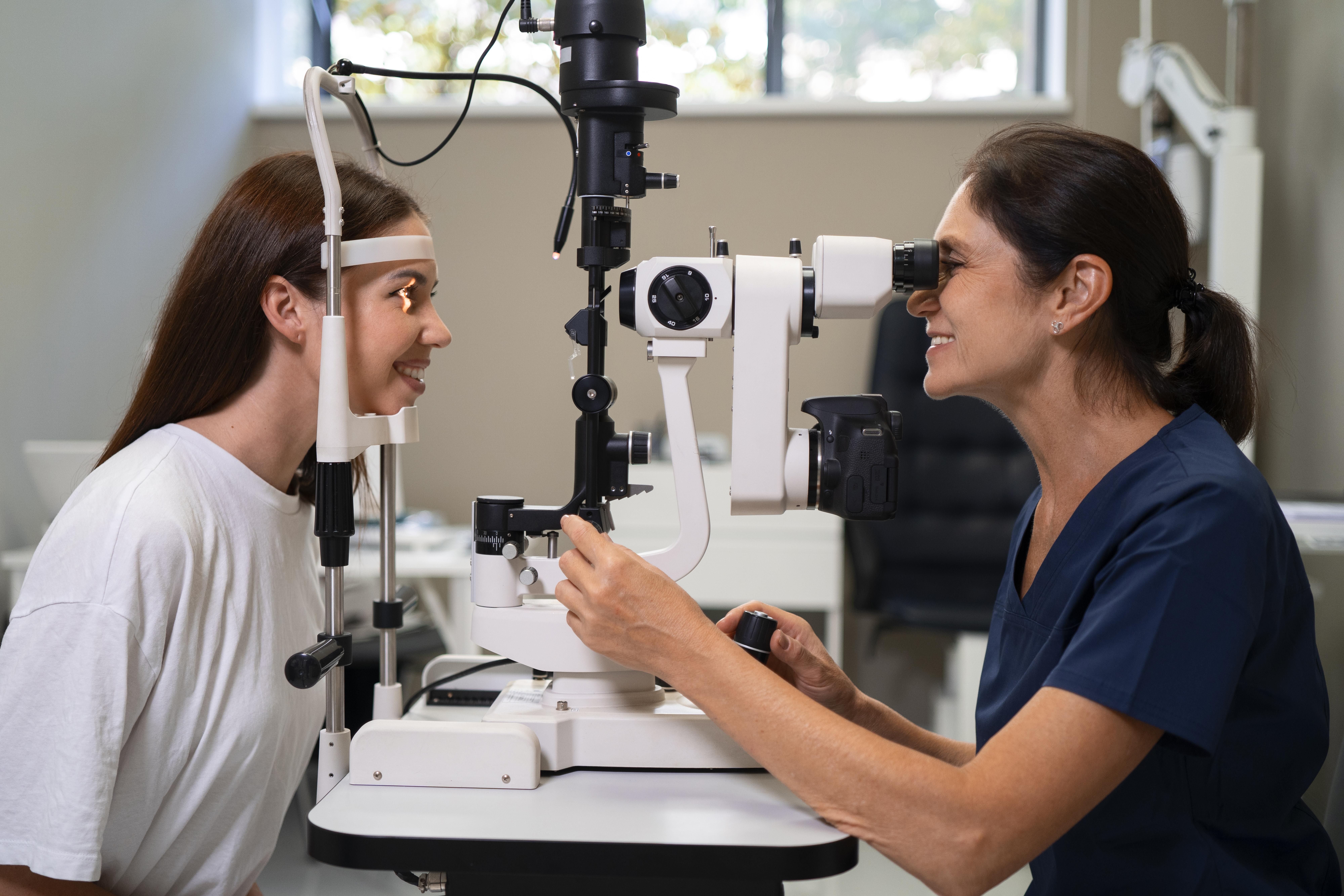 medium shot woman getting her eyes checked