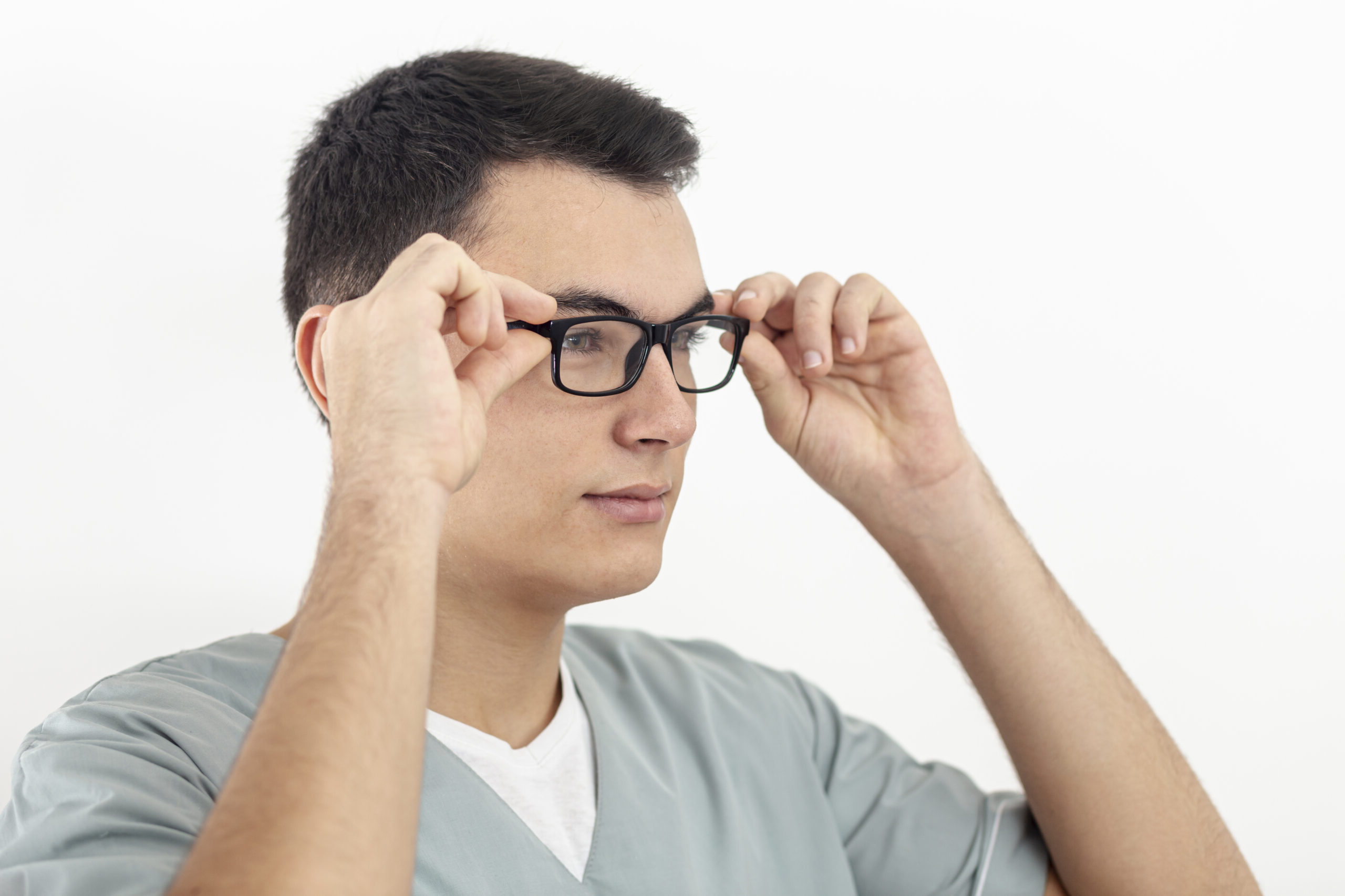 side view man trying his glasses