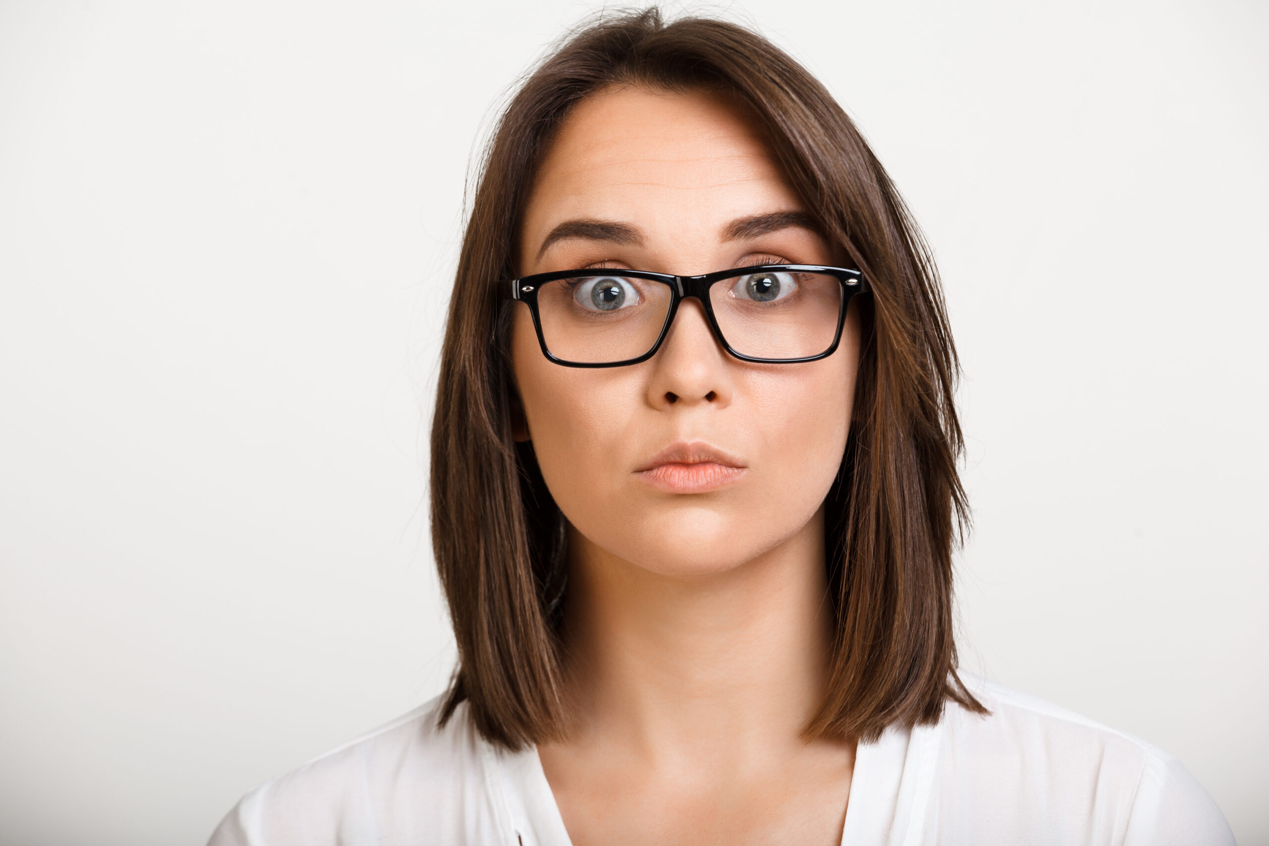 portrait of girl playing ape over white background.